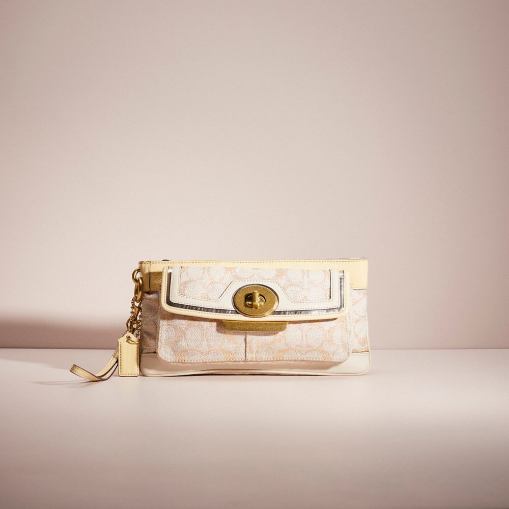 Restored Penelope Clutch In Signature
