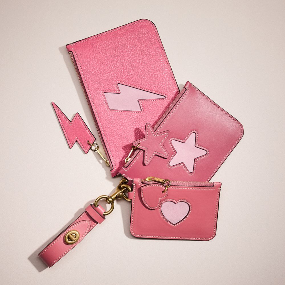 COACH®,REMADE TRIO POUCH SET WITH CUT OUTS,Pink Multi,Front View