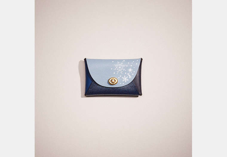 COACH®,REMADE MEDIUM POUCH WITH HAND PAINTED SNOWFLAKES,Holiday Glow Up,Blue Multi,Front View