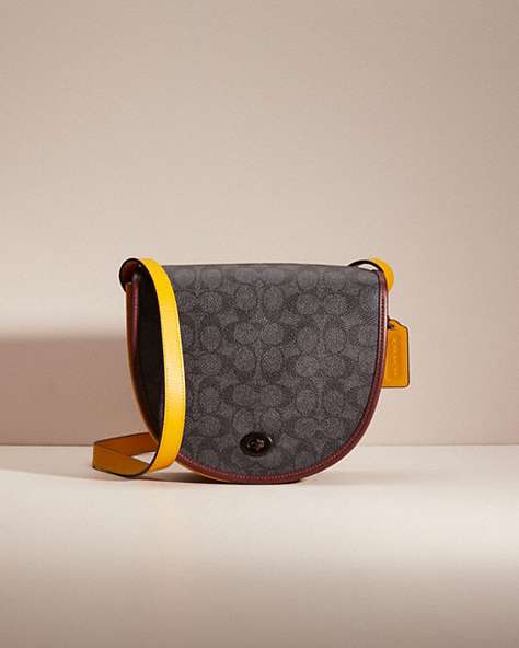 COACH®,RESTORED TURNLOCK SADDLE CROSSBODY IN SIGNATURE CANVAS,Black Copper/Charcoal Multi,Front View