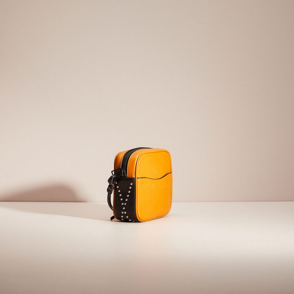 COACH®,RESTORED POUCH 12 WITH WHIPSTITCH,Amber/Black,Angle View