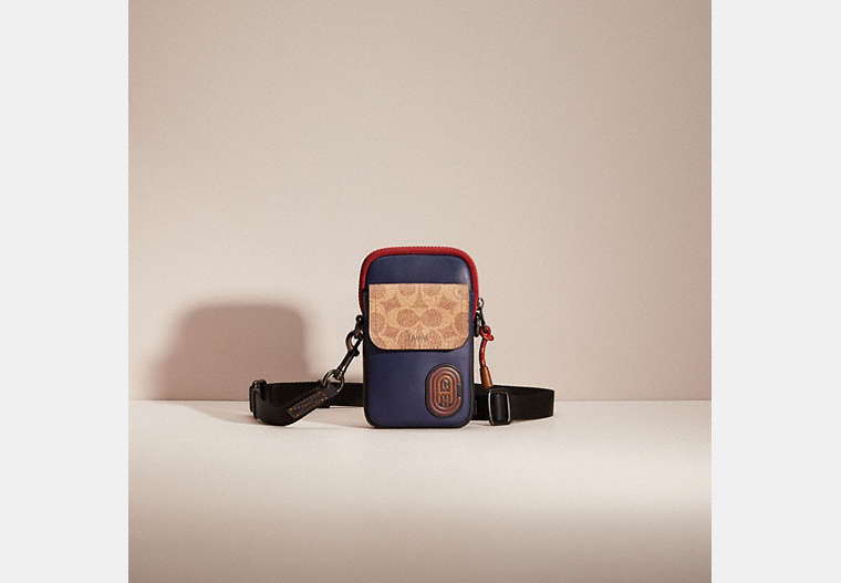 COACH®,RESTORED PACER CONVERTIBLE POUCH IN COLORBLOCK SIGNATURE CANVAS WITH COACH PATCH,True Navy Multi,Front View