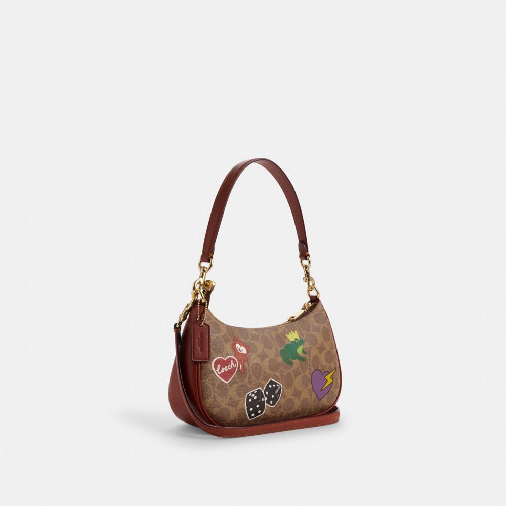 COACH ステッカー付きショルダーバッグ