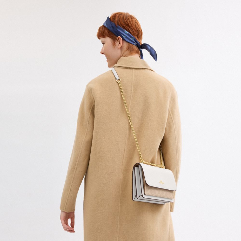 COACH®,Klare Crossbody Bag In Signature Canvas,Crossbody,Chain Detail,Pattern,Day Party,White,Detail View