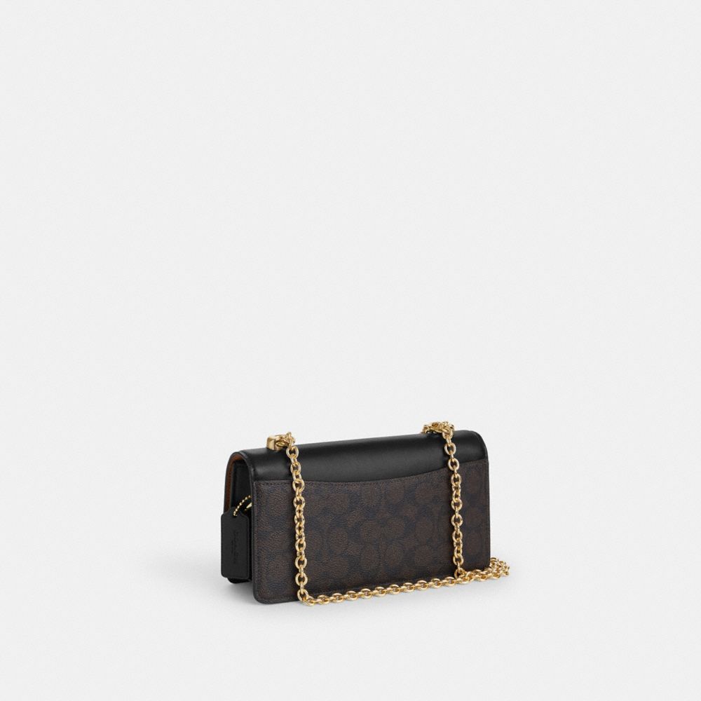 COACH®,Eliza Flap Crossbody Bag In Signature Canvas,,Angle View