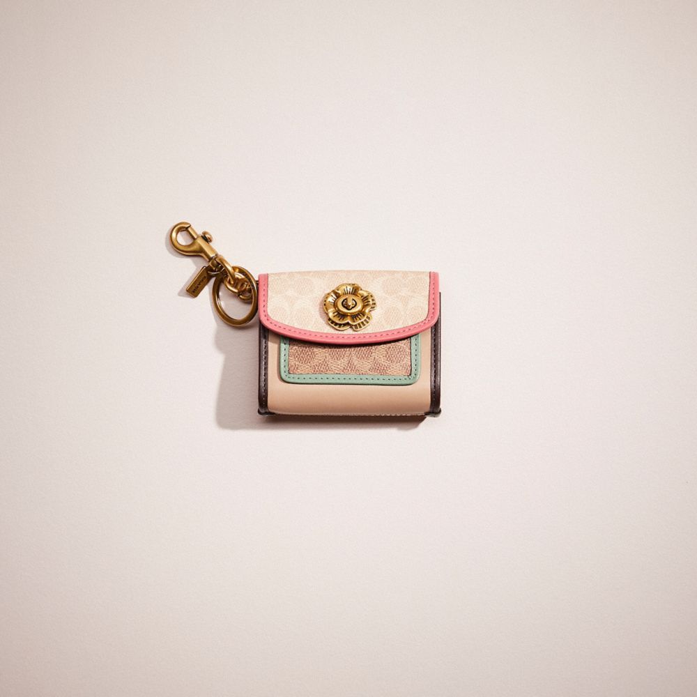 Earbud case bag charm in signature canvas hot sale