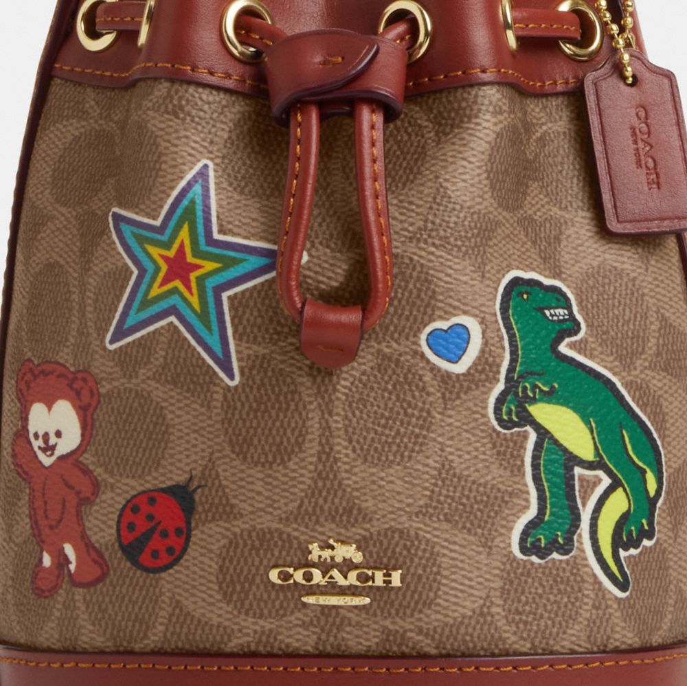 COACH®,Mini Bucket Bag In Signature Canvas With Sticker Print,