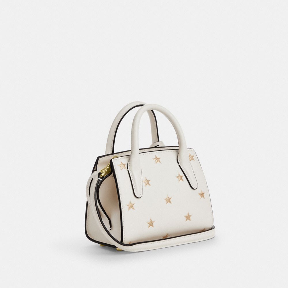 COACH®,Andrea Mini Carryall Bag With Star Print,Calfskin Leather,Satchel,Logo,Glitter,Metal,Day Party,Cream,Angle View