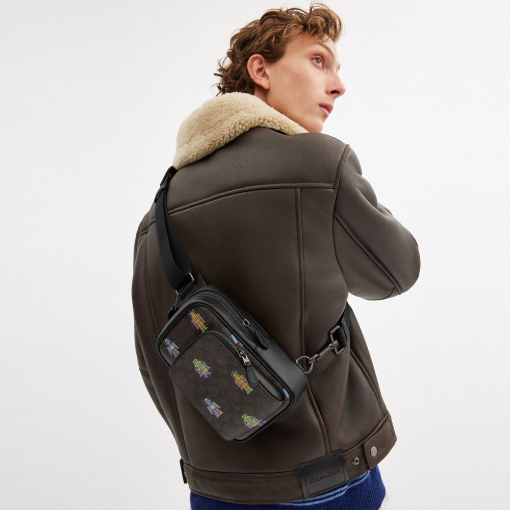 COACH®,Cosmic Coach Racer Sling Pack In Signature Canvas With Robot Print,,Detail View