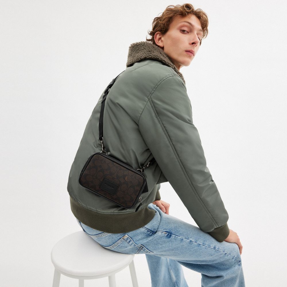 COACH®,Carrier Phone Crossbody In Signature Canvas,Calfskin Leather,Canvas,Crossbody,Casual,Black,Detail View
