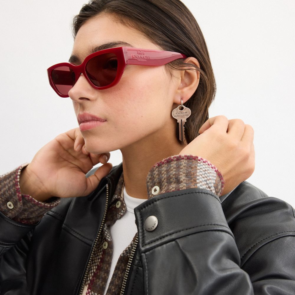 COACH®,Geometric Cat Eye Sunglasses,Cat Eye,Logo,Metal,Integrated Nose Pads,Casual,Maroon,Angle View