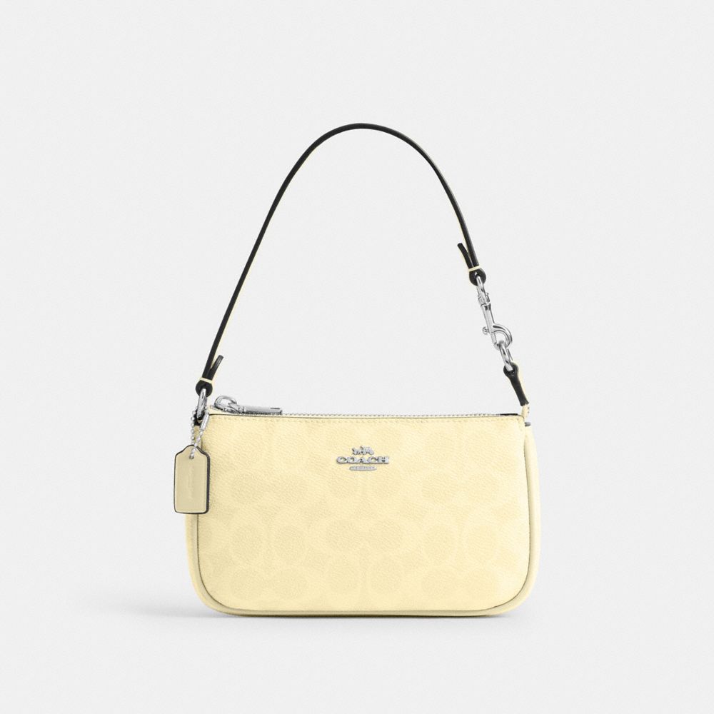 COACH®,NOLITA 19 EN TOILE EXCLUSIVE,Toile exclusive,Argent/Foin,Front View