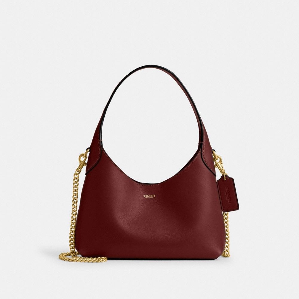 Coach In Brass/dark Ruby