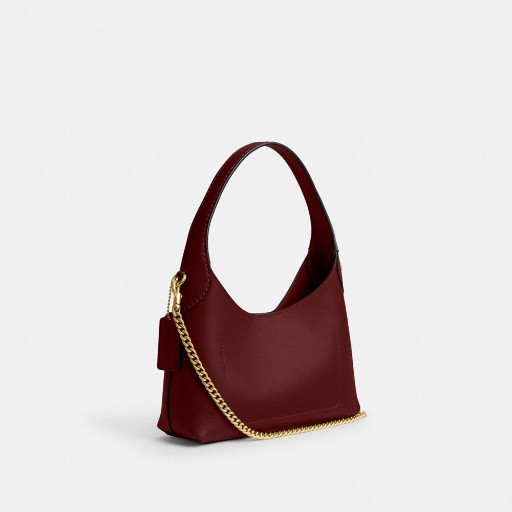 Coach In Brass/dark Ruby