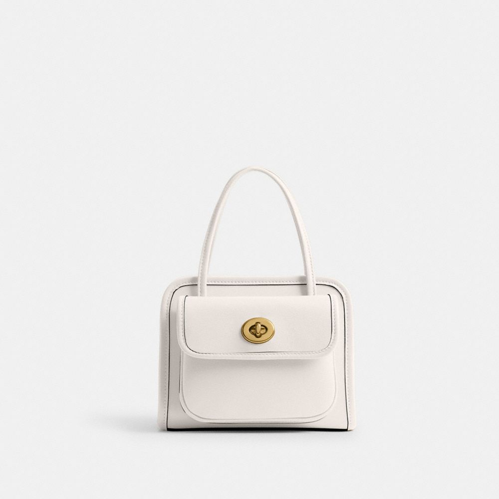 Shop Coach Safari Bag In Brass/chalk