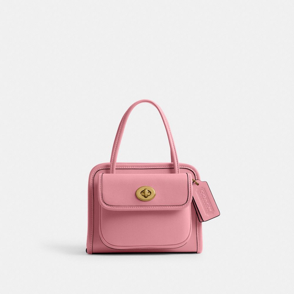 Shop Coach Safari Bag In Brass/true Pink