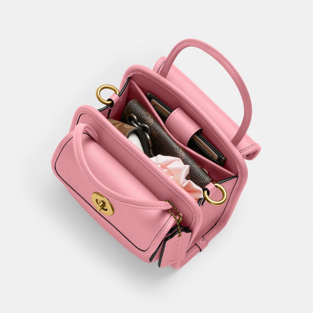 Shop Coach Safari Bag In Brass/true Pink