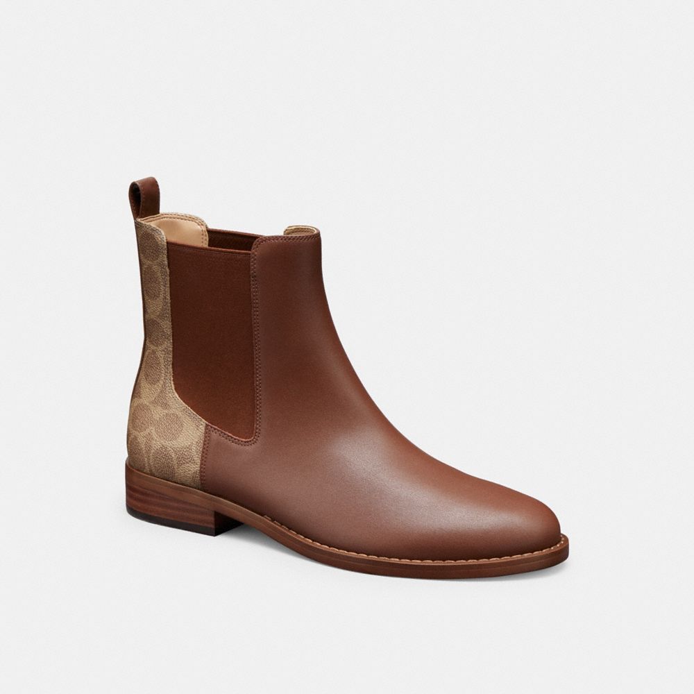 Coach signature boots on sale