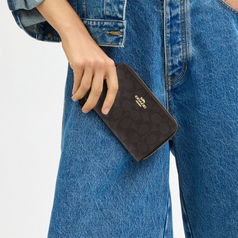 COACH®,Medium Id Zip Wallet In Signature Canvas,Continental,Coin,Bi Fold,Sustainable,Casual,Brown,Detail View