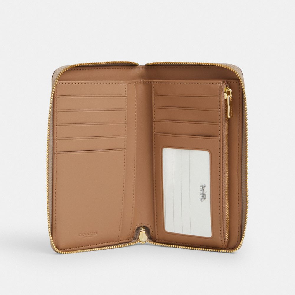 COACH® Outlet | Medium Id Zip Wallet In Signature Canvas