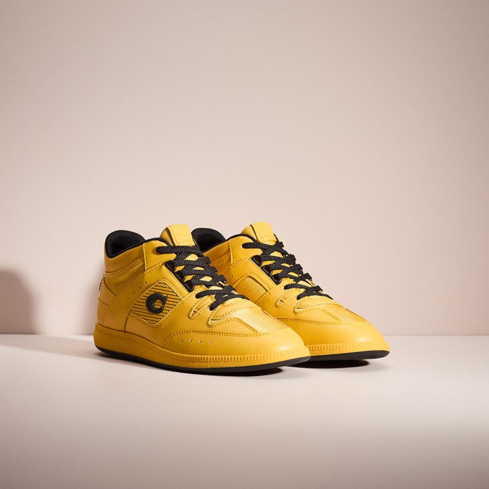 COACH®,RESTORED CITYSOLE MID TOP SNEAKER,Leather,Canary,Angle View