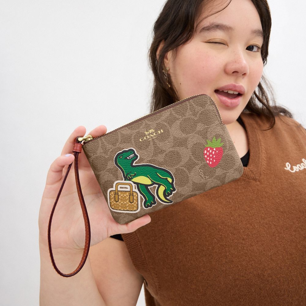 COACH®,Corner Zip Wristlet In Signature Canvas With Sticker Print,Wristlet,Casual,Brown,Detail View