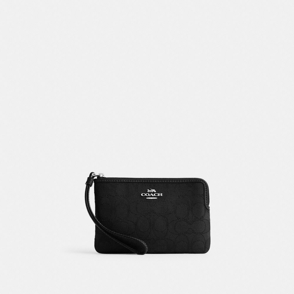 COACH®,WRISTLE À ZIP EN COIN EN JACQUARD SIGNATURE,Faux cuir,Argent/Noir,Front View