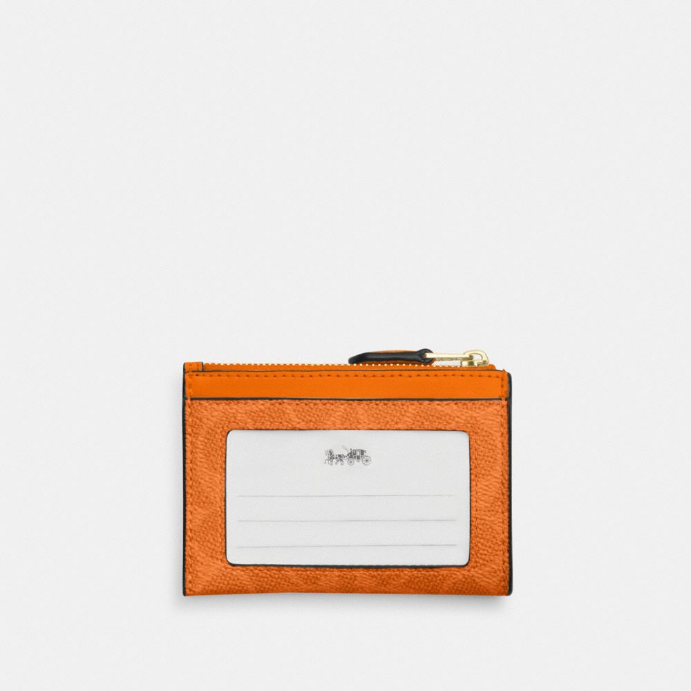 COACH®,Mini Skinny Id Case In Signature Canvas,Card Case,Logo,Metal,Color Block,Key Ring,Sustainable,Casual,Burnt Orange,Back View