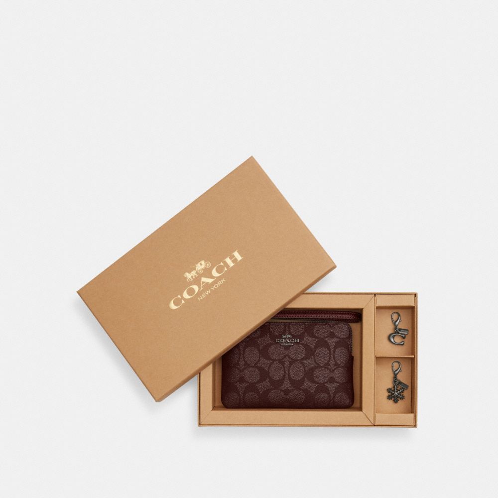 COACH®,Boxed Corner Zip Wristlet In Signature Canvas With Charms,Canvas,Leather,Wristlet,Faux Leather,Metal,Casual,Maroon,Front View