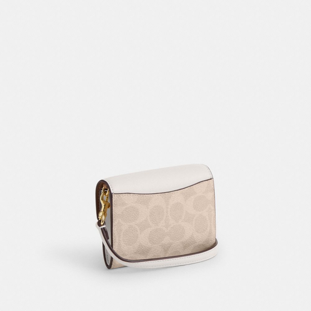 COACH®,Mini Envelope Wallet With Strap In Signature Canvas,,Angle View