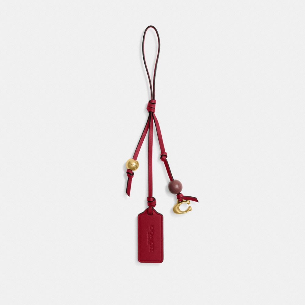 COACH®,Heritage Bag Charm,Metal Material,Ruby,Bead Embellishment,Logo,Engraving,Brass,Casual,Maroon,Front View