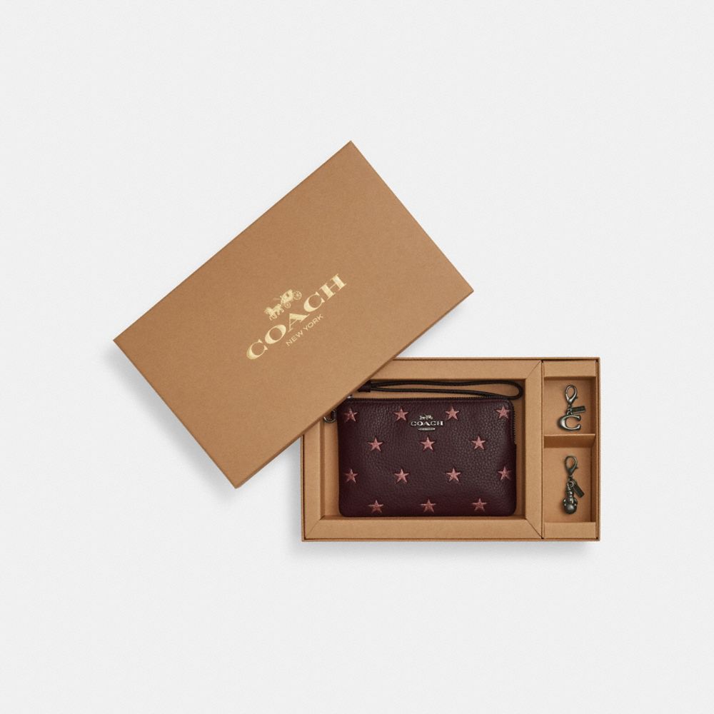 COACH®,Boxed Corner Zip Wristlet With Star Print And Charms,Leather,Wristlet,Metal,Logo,Casual,Brown,Front View