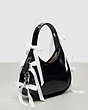 COACH®,Ergo Bag in Crinkle Patent Coachtopia Leather with Bows All Over,Black,Angle View