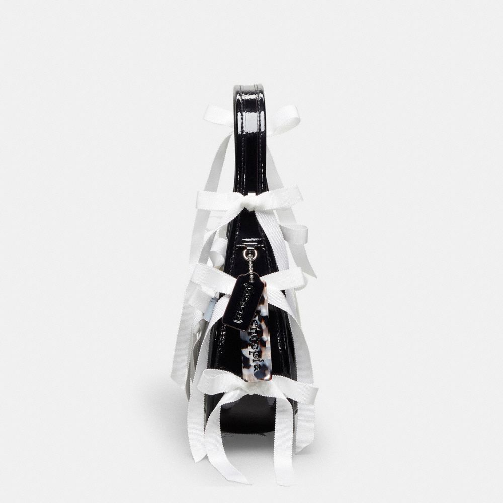 Coach Ergo Bag In Crinkle Patent Topia Leather With Bows All Over In Black