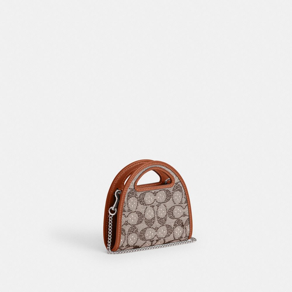 COACH®,PORTE-CARTES AVEC POIGNÉE SUPÉRIEURE EN JACQUARD SIGNATURE AVEC CRISTAUX,Argent/Ambre polie,Angle View