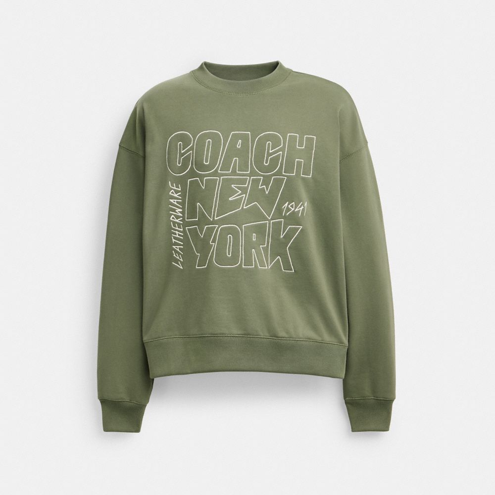 COACH®,CHANDAIL À ENCOLURE RAS-DE-COU AVEC ILLUSTRATION NEW YORK,Vert olive,Front View