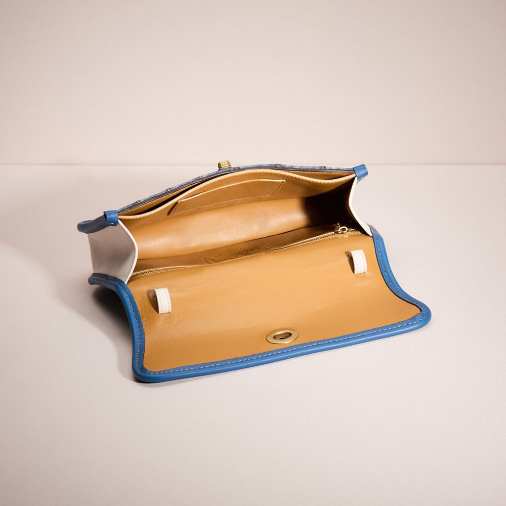 COACH®,Upcrafted Turnlock Clutch,Leather,Lining Leather,Denim,Satchel,Plastic,Ball Embellishment,Logo,Mixed Media,Piping,C...,Multi Color,Inside View,Top View