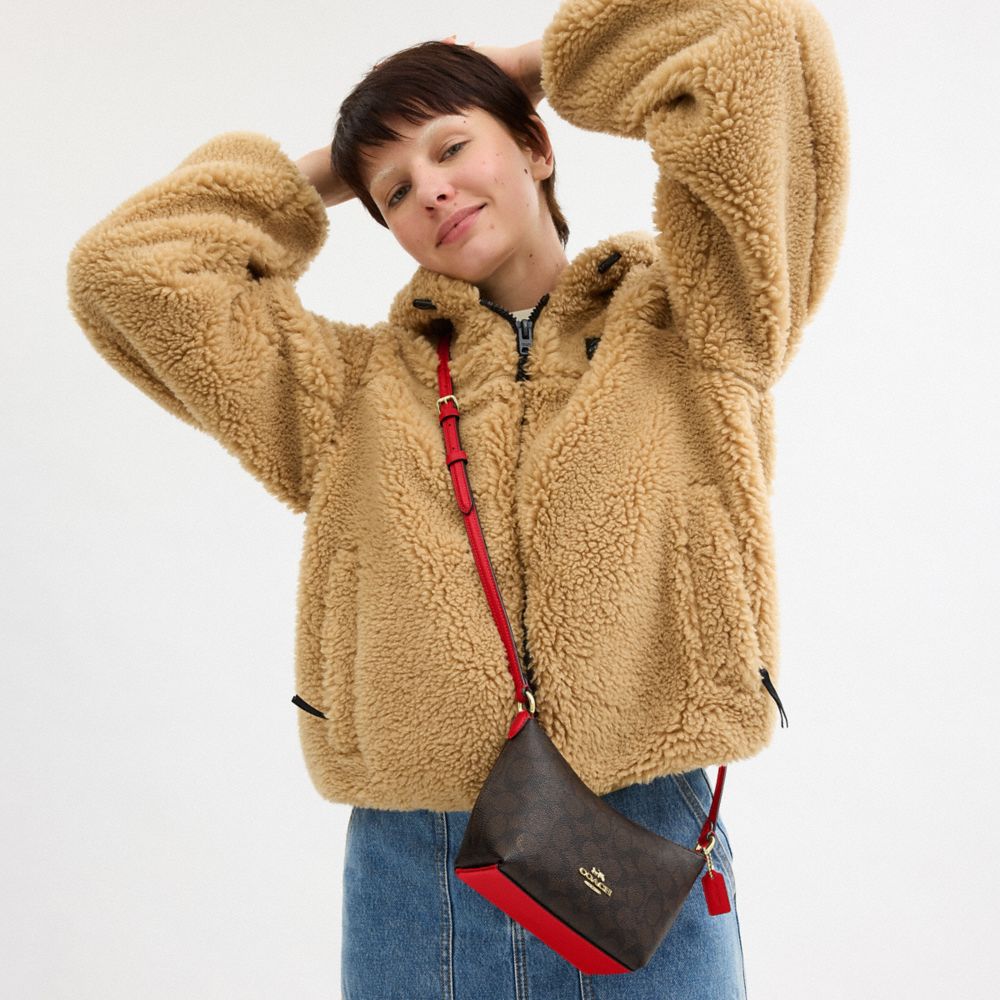 COACH®,Zip Top Crossbody Bag In Signature Canvas,Canvas,Leather,Crossbody,Adjustable,Casual,Brown,Detail View