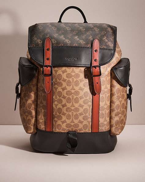 COACH®,RESTORED HITCH BACKPACK IN SIGNATURE CANVAS WITH HORSE AND CARRIAGE PRINT,Black Copper/Truffle Multi,Front View