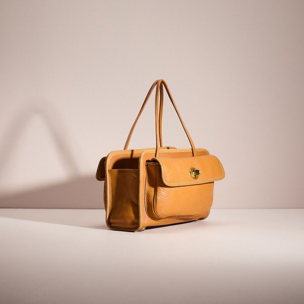 COACH®,VINTAGE BONNIE CASHIN MINI SAFARI BAG,Glovetanned Leather,Medium,Bonnie Cashin Edit,Camel,Angle View