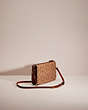 COACH®,UPCRAFTED NOA POP-UP MESSENGER IN SIGNATURE CANVAS,Garden Party,Brass/Tan/Rust,Angle View