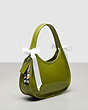 COACH®,Ergo Bag in Crinkle Patent Coachtopia Leather with Bows,Olive/White,Angle View