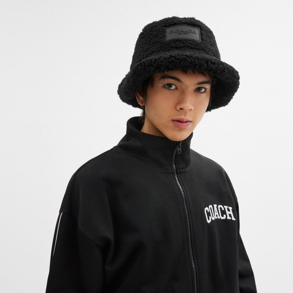COACH®,Sherpa Bucket Hat,Cotton,Sherpa,Lining Polyester,Polyester,Bucket,Applique,Logo,Casual,Black,Angle View
