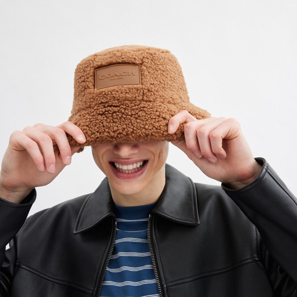 COACH®,Sherpa Bucket Hat,Cotton,Sherpa,Lining Polyester,Polyester,Bucket,Applique,Logo,Casual,Brown,Angle View