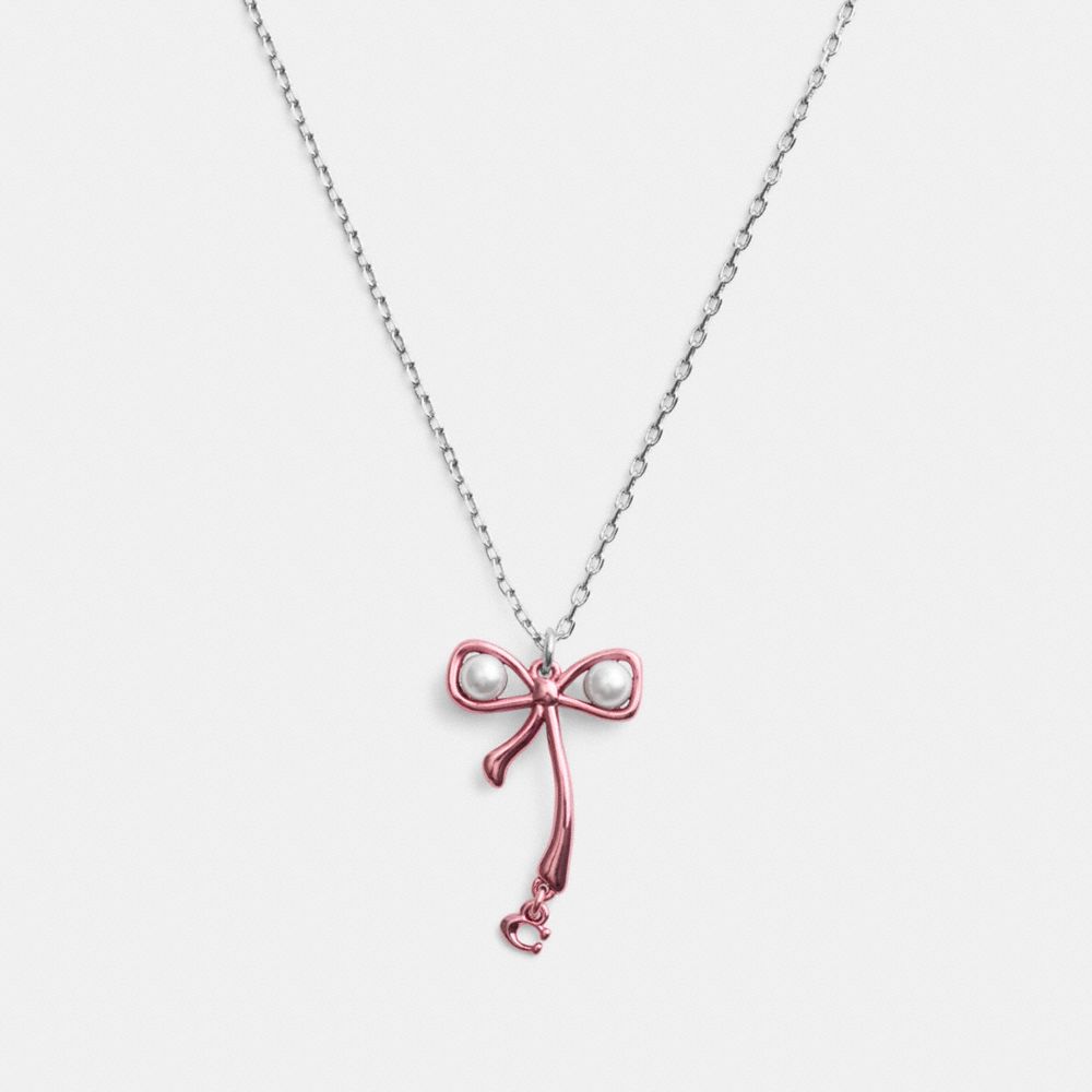 Shop Coach Bow Pearl Pendant Necklace In Silver/pink