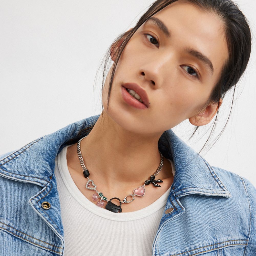 COACH®,Bow And Heart Charm Necklace,Single Strand,Pearl,Cubic Zirconia,Glass,Enamel,Resin,Crystal,Gem Embellishment,Bow,Lo...,Multi Color,Detail View