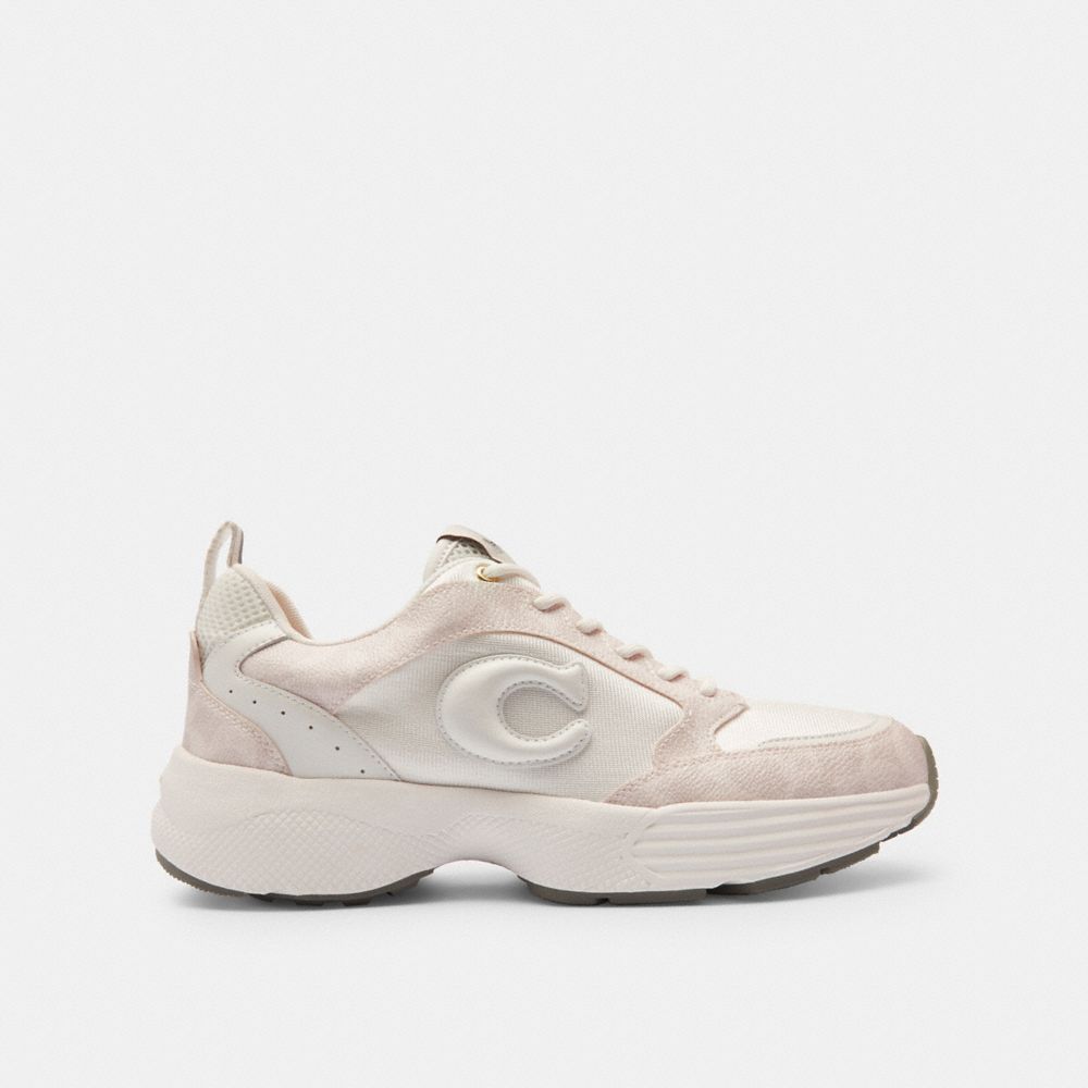 COACH®,Strider Sneaker In Signature Canvas,Cream,Angle View