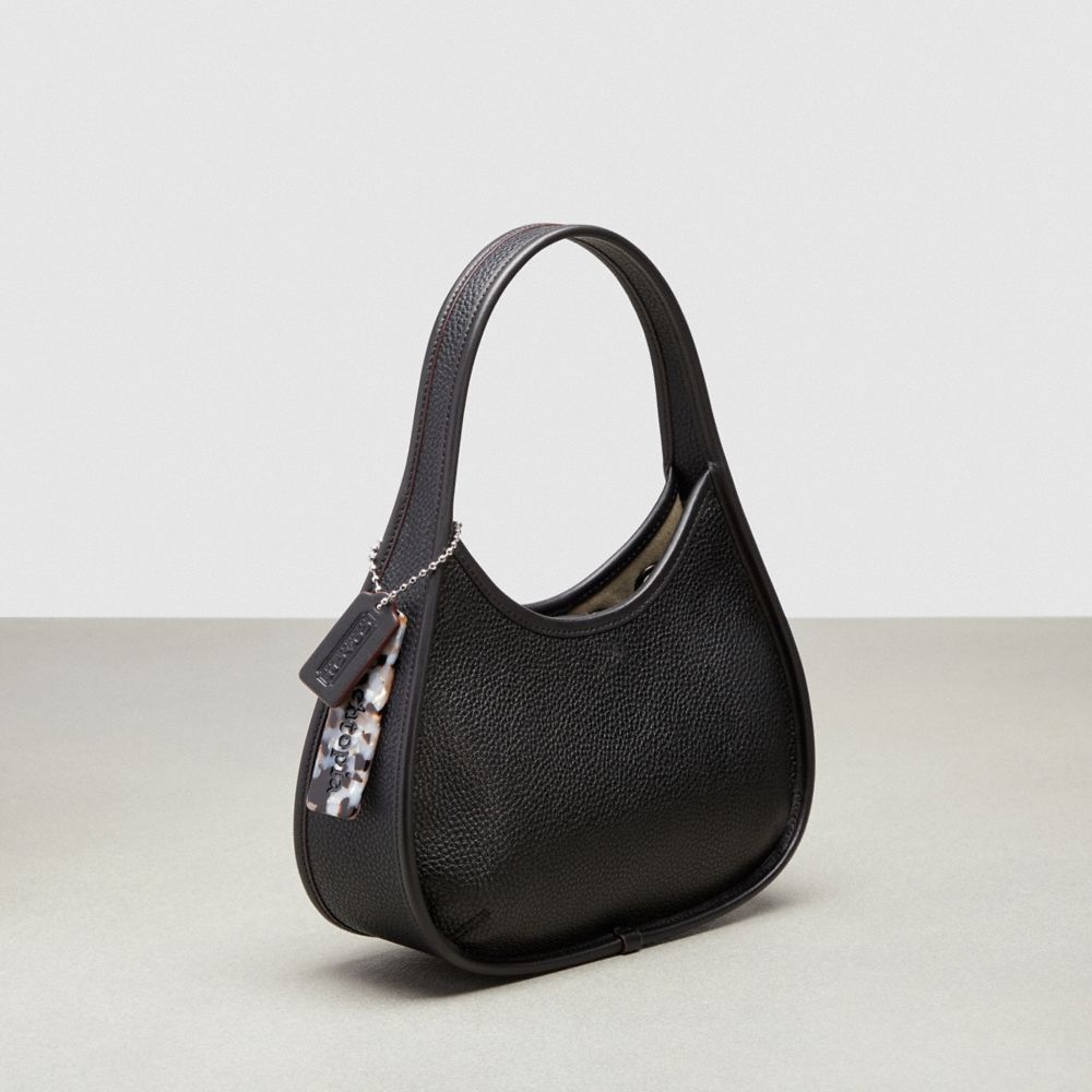 COACH®,Ergo Bag in Pebbled Coachtopia Leather: Grommets,Small,Black,Angle View
