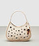 COACH®,Ergo Bag in Pebbled Coachtopia Leather: Grommets,Small,Cloud,Front View