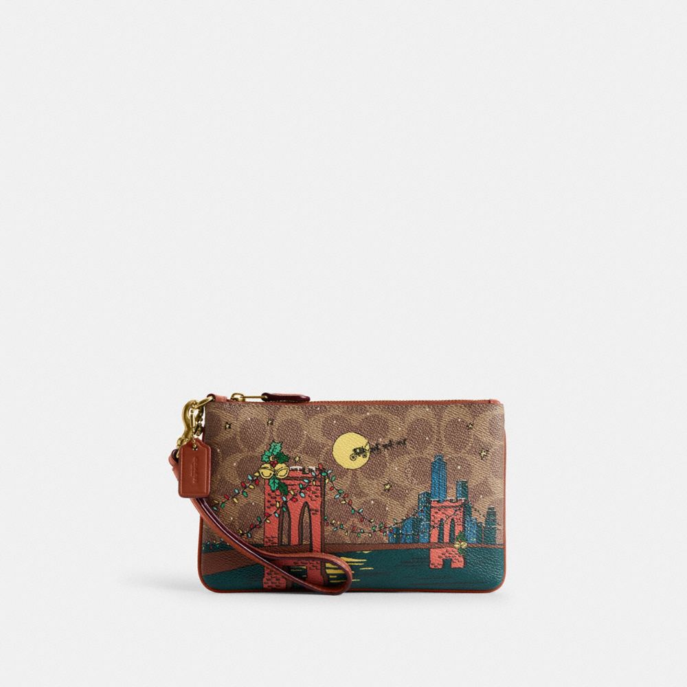 COACH®,Holiday Essential Small Wristlet In Signature Canvas With Brooklyn Bridge Scene,,Front View